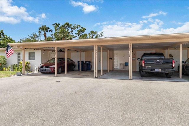 5062 White Oak Ct, Bradenton, FL 34207 - view of vehicle parking featuring asphalt driveway and a carport
