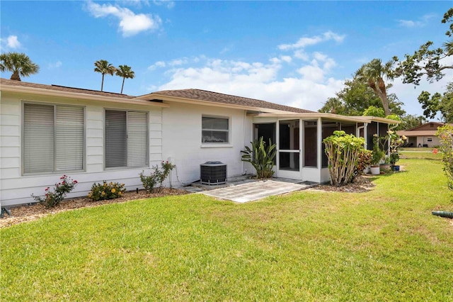 5062 White Oak Ct, Bradenton, FL 34207 - back of property with central AC unit, a sunroom, and a yard