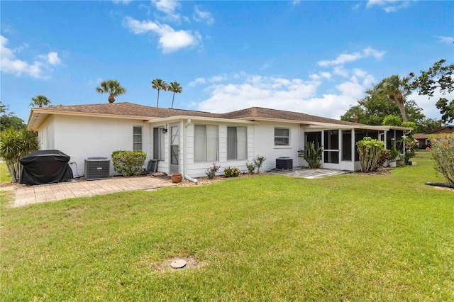 5062 White Oak Ct, Bradenton, FL 34207 - back of house with cooling unit, a sunroom, a yard, and stucco siding
