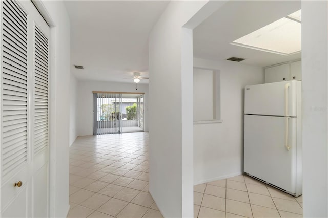 5062 White Oak Ct, Bradenton, FL 34207 - kitchen featuring freestanding refrigerator, a ceiling fan, and light tile patterned floors