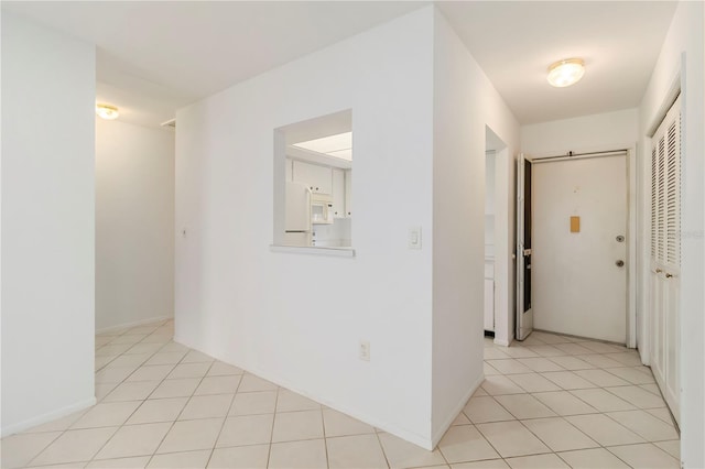 5062 White Oak Ct, Bradenton, FL 34207 - hallway featuring light tile patterned floors
