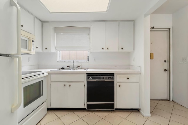 5062 White Oak Ct, Bradenton, FL 34207 - kitchen with white appliances, a sink, light countertops, white cabinetry, and light tile patterned floors
