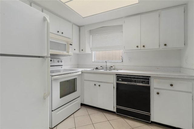 5062 White Oak Ct, Bradenton, FL 34207 - kitchen featuring white appliances, a sink, light countertops, white cabinetry, and light tile patterned flooring