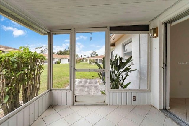 5062 White Oak Ct, Bradenton, FL 34207 - unfurnished sunroom featuring a residential view