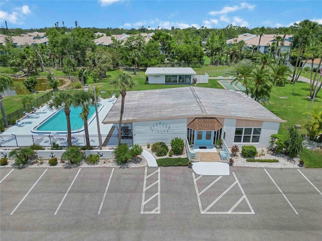 5062 White Oak Ct, Bradenton, FL 34207 - view of property with a community pool and uncovered parking