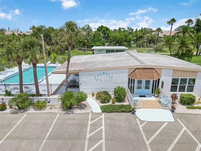 5062 White Oak Ct, Bradenton, FL 34207 - view of building exterior featuring a community pool and uncovered parking