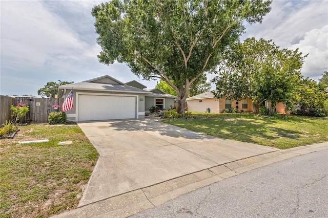 4222 Lanai Dr, Sarasota, FL 34241 - ranch-style house featuring concrete driveway, a garage, and stucco siding