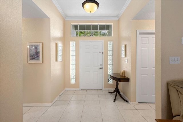 4222 Lanai Dr, Sarasota, FL 34241 - foyer entrance featuring ornamental molding, baseboards, light tile patterned floors, and a textured wall