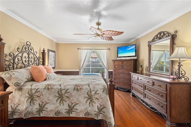 4222 Lanai Dr, Sarasota, FL 34241 - bedroom featuring dark wood finished floors, ornamental molding, and a ceiling fan