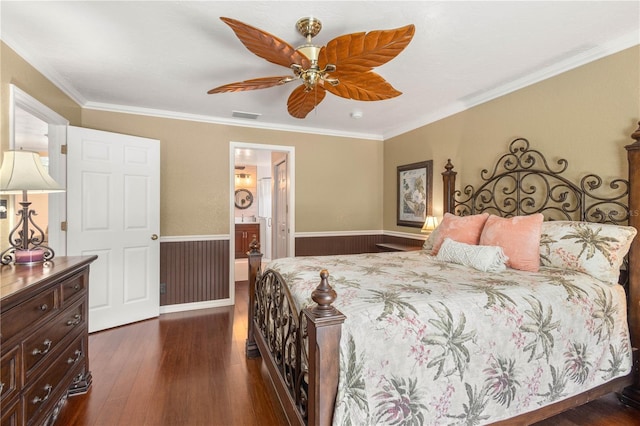 4222 Lanai Dr, Sarasota, FL 34241 - bedroom with wainscoting, dark wood-style flooring, ornamental molding, a ceiling fan, and ensuite bathroom