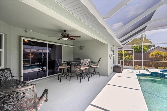 4222 Lanai Dr, Sarasota, FL 34241 - view of patio featuring ceiling fan, outdoor dining area, and glass enclosure