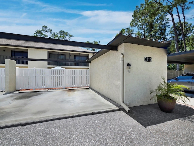 6110 Country Club Way Unit 102, Sarasota, FL 34243 - view of property exterior featuring stucco siding