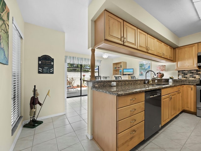 6110 Country Club Way Unit 102, Sarasota, FL 34243 - kitchen with appliances with stainless steel finishes, a sink, a peninsula, light tile patterned flooring, and dark stone counters