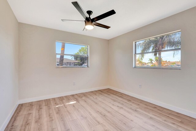 2420 16th St W, Palmetto, FL 34221 - unfurnished room with wood finished floors, baseboards, and a ceiling fan