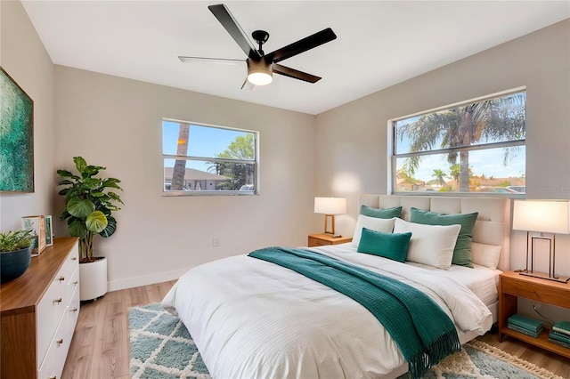 2420 16th St W, Palmetto, FL 34221 - bedroom with light wood-type flooring, baseboards, and a ceiling fan