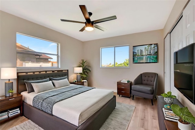 2420 16th St W, Palmetto, FL 34221 - bedroom featuring multiple windows, light wood-type flooring, a closet, and a ceiling fan