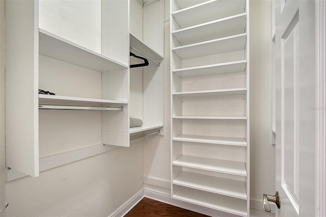 4108 Roberts Point Rd, Sarasota, FL 34242 - walk in closet with wood finished floors