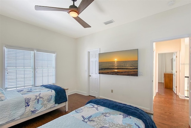 4108 Roberts Point Rd, Sarasota, FL 34242 - bedroom with wood finished floors, baseboards, and a ceiling fan