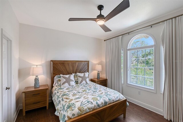 4108 Roberts Point Rd, Sarasota, FL 34242 - bedroom featuring baseboards, wood finished floors, and a ceiling fan