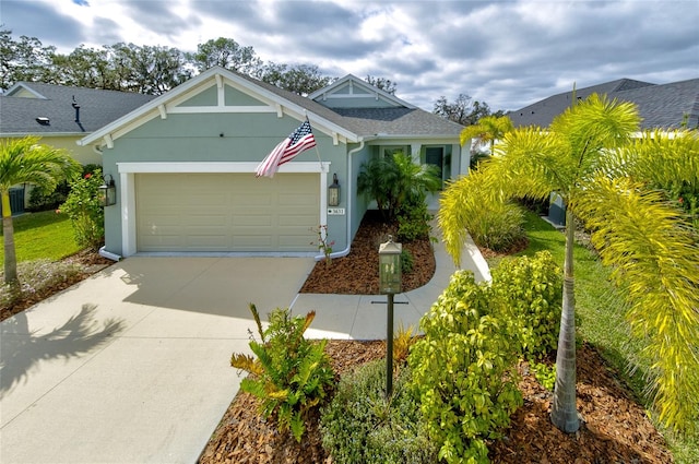 3631 Shimmering Oaks Dr, Parrish, FL 34219 - view of front of property featuring an attached garage, concrete driveway, and stucco siding