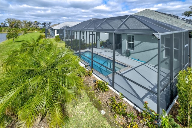 3631 Shimmering Oaks Dr, Parrish, FL 34219 - back of property featuring a lanai, an outdoor pool, a patio, and a shingled roof