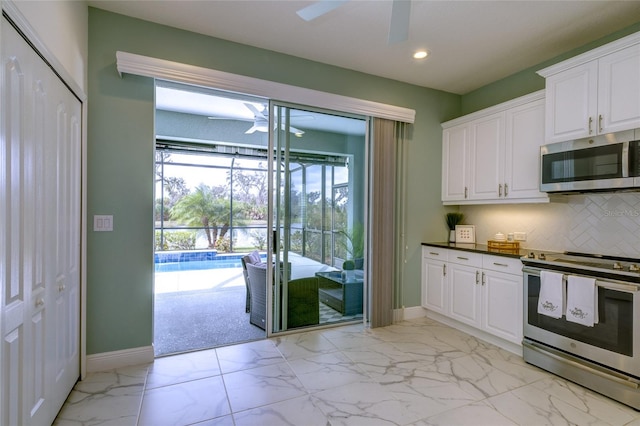 3631 Shimmering Oaks Dr, Parrish, FL 34219 - kitchen featuring appliances with stainless steel finishes, ceiling fan, baseboards, and recessed lighting