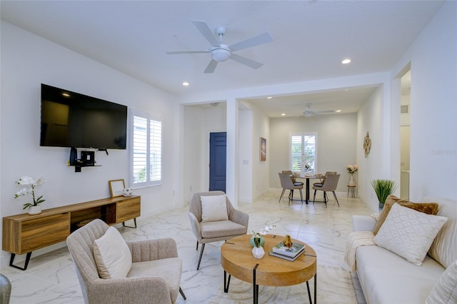 3631 Shimmering Oaks Dr, Parrish, FL 34219 - living area featuring light marble finish flooring, ceiling fan, and recessed lighting