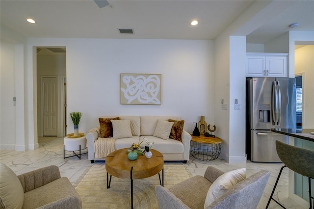 3631 Shimmering Oaks Dr, Parrish, FL 34219 - living area featuring light marble finish flooring, baseboards, and recessed lighting