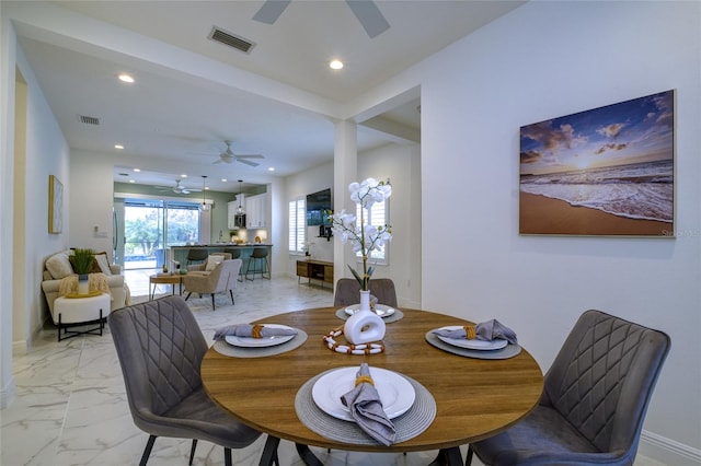 3631 Shimmering Oaks Dr, Parrish, FL 34219 - dining area with a ceiling fan, light marble finish flooring, and recessed lighting