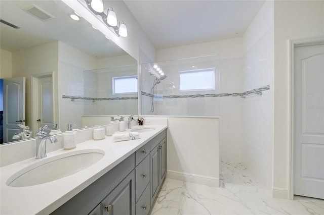 3631 Shimmering Oaks Dr, Parrish, FL 34219 - bathroom featuring a walk in shower, double vanity, marble finish floors, and baseboards