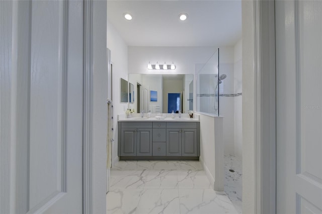 3631 Shimmering Oaks Dr, Parrish, FL 34219 - bathroom featuring marble look tiles, a walk in shower, double vanity, and recessed lighting