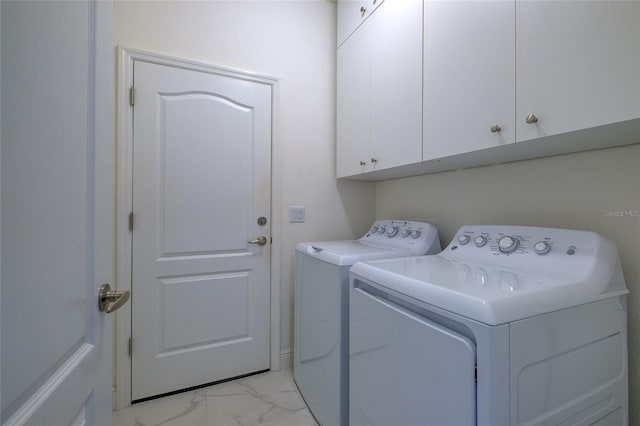 3631 Shimmering Oaks Dr, Parrish, FL 34219 - laundry area with cabinet space, light marble finish floors, and separate washer and dryer