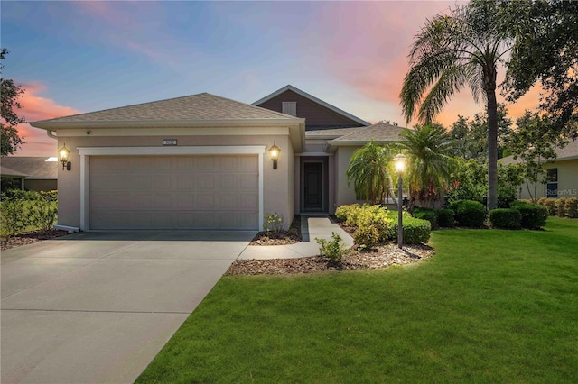 5020 Torrey Pines Run, Bradenton, FL 34211 - single story home featuring driveway, a garage, stucco siding, and a front yard