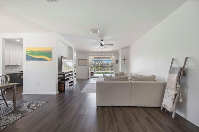 5020 Torrey Pines Run, Bradenton, FL 34211 - living area featuring baseboards, dark wood-style flooring, and a ceiling fan