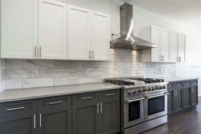 5020 Torrey Pines Run, Bradenton, FL 34211 - kitchen with range hood, double oven range, white cabinetry, and backsplash