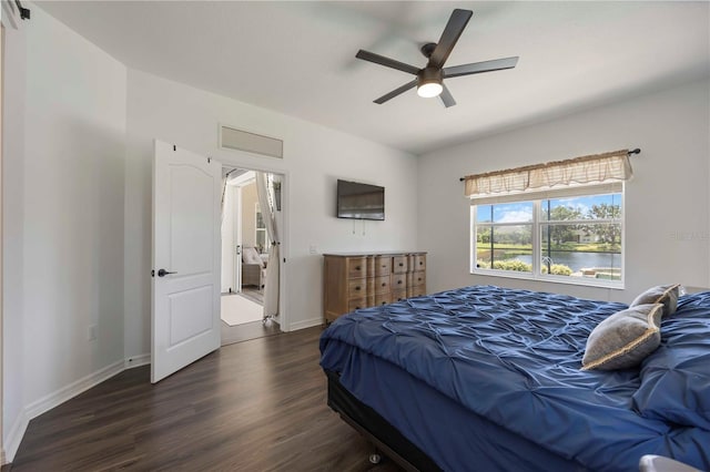 5020 Torrey Pines Run, Bradenton, FL 34211 - bedroom with dark wood-style floors, baseboards, and a ceiling fan