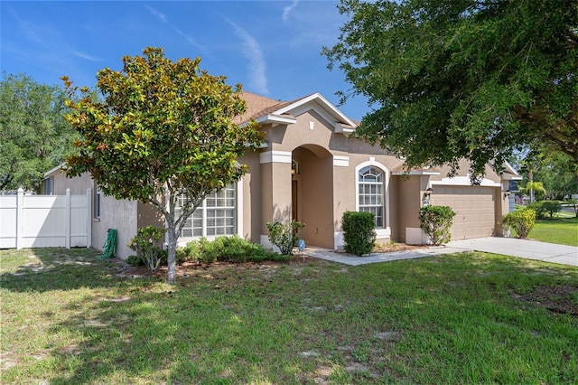 4951 Brightstone Pl, Spring Hill, FL 34609 - view of front facade with stucco siding, driveway, and a garage