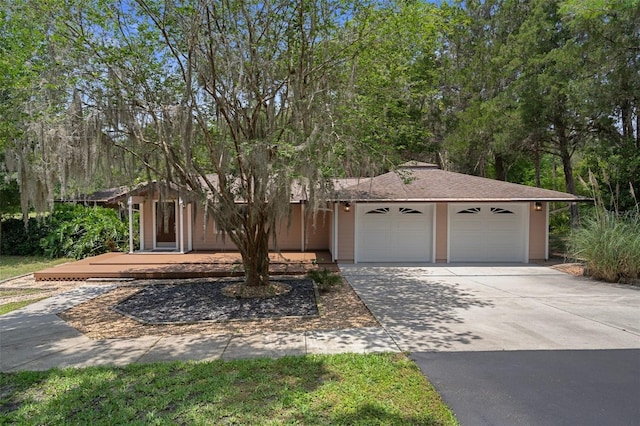 22063 Lake Lindsey Rd, Brooksville, FL 34601 - view of front of house featuring an attached garage and driveway