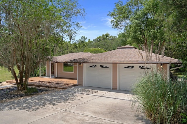 22063 Lake Lindsey Rd, Brooksville, FL 34601 - view of front of house with a garage, driveway, and roof with shingles