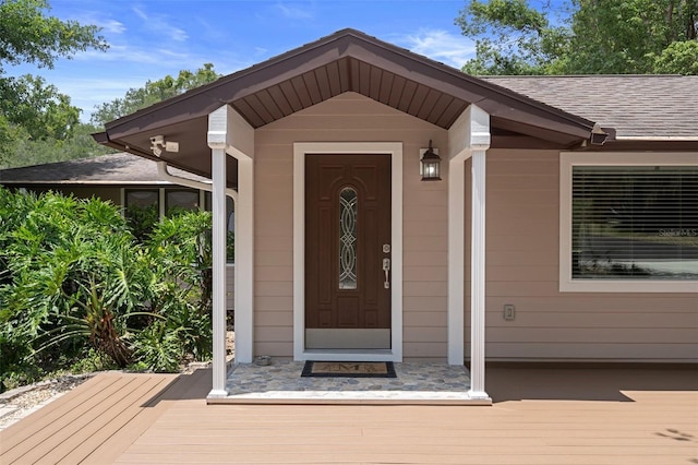 22063 Lake Lindsey Rd, Brooksville, FL 34601 - view of exterior entry featuring a shingled roof