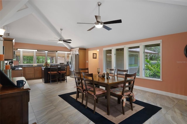 22063 Lake Lindsey Rd, Brooksville, FL 34601 - dining space featuring vaulted ceiling, ceiling fan, and baseboards