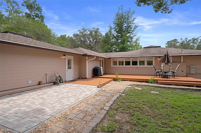22063 Lake Lindsey Rd, Brooksville, FL 34601 - rear view of property with a deck, a patio, and a lawn