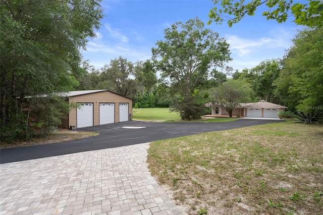 22063 Lake Lindsey Rd, Brooksville, FL 34601 - detached garage with view of wooded area