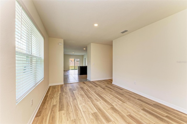 4206 Park Willow Ave, Palmetto, FL 34221 - spare room with light wood-type flooring, baseboards, and recessed lighting