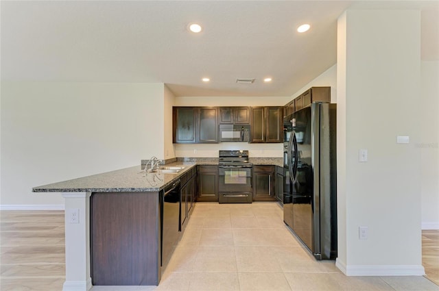 4206 Park Willow Ave, Palmetto, FL 34221 - kitchen featuring black appliances, a sink, baseboards, a peninsula, and dark brown cabinets