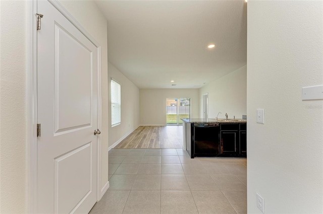4206 Park Willow Ave, Palmetto, FL 34221 - corridor featuring a sink, light tile patterned flooring, recessed lighting, and baseboards