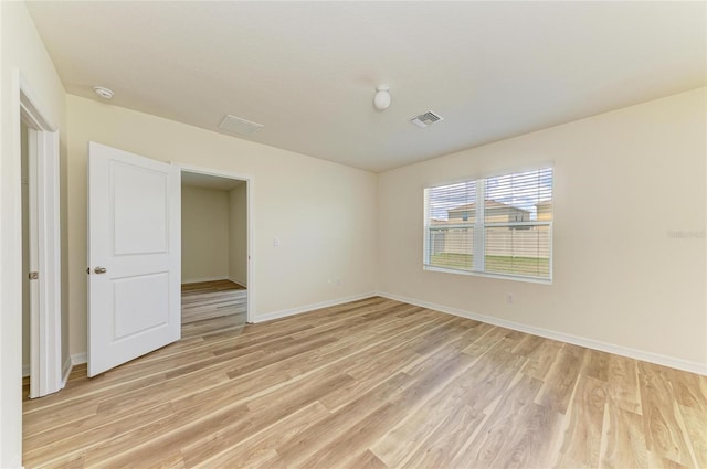 4206 Park Willow Ave, Palmetto, FL 34221 - unfurnished room with light wood finished floors, a smoke detector, and baseboards