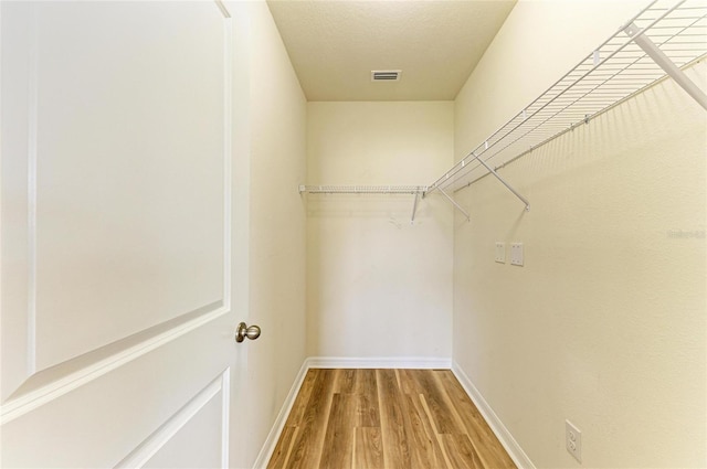 4206 Park Willow Ave, Palmetto, FL 34221 - walk in closet featuring wood finished floors