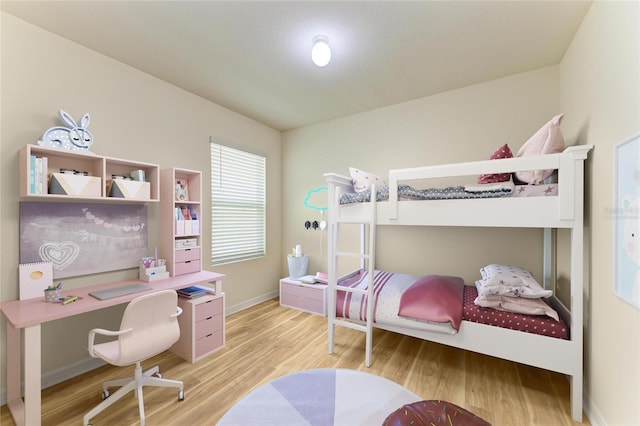 4206 Park Willow Ave, Palmetto, FL 34221 - bedroom with wood finished floors, a desk, and baseboards
