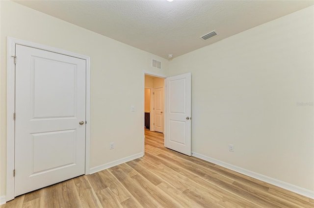 4206 Park Willow Ave, Palmetto, FL 34221 - unfurnished bedroom featuring light wood-type flooring and baseboards
